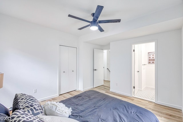 bedroom featuring a closet, light hardwood / wood-style floors, and ceiling fan