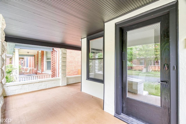 unfurnished sunroom featuring a wealth of natural light