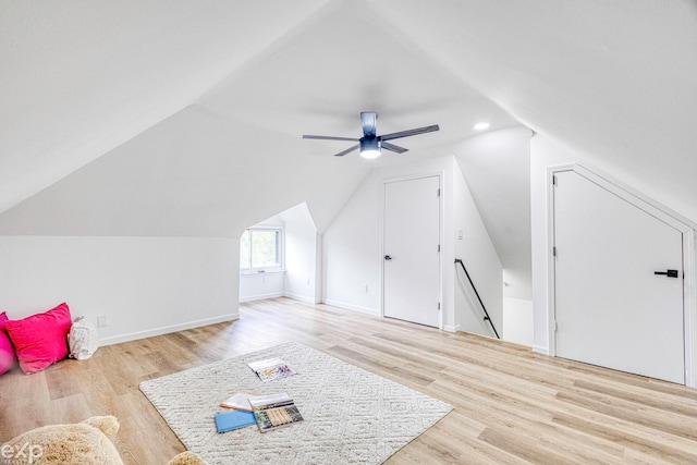 bonus room with ceiling fan, lofted ceiling, and light wood-type flooring