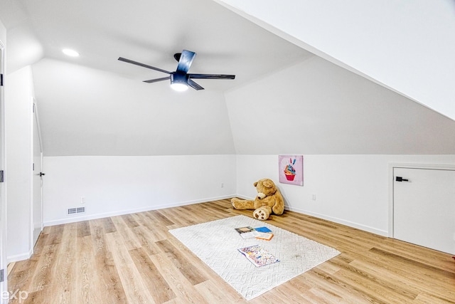 game room with light hardwood / wood-style floors, ceiling fan, and lofted ceiling