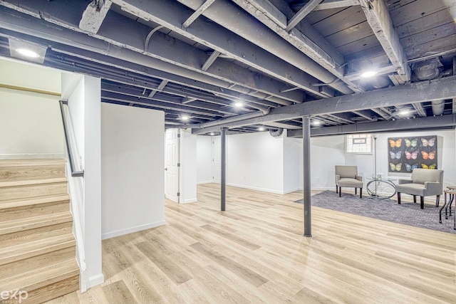 basement with wood-type flooring