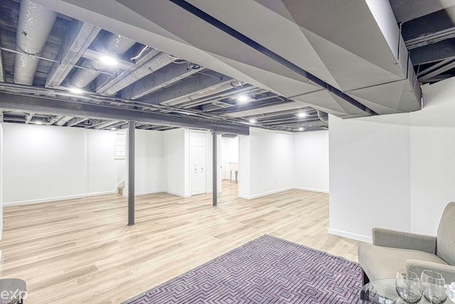 basement featuring light wood-type flooring