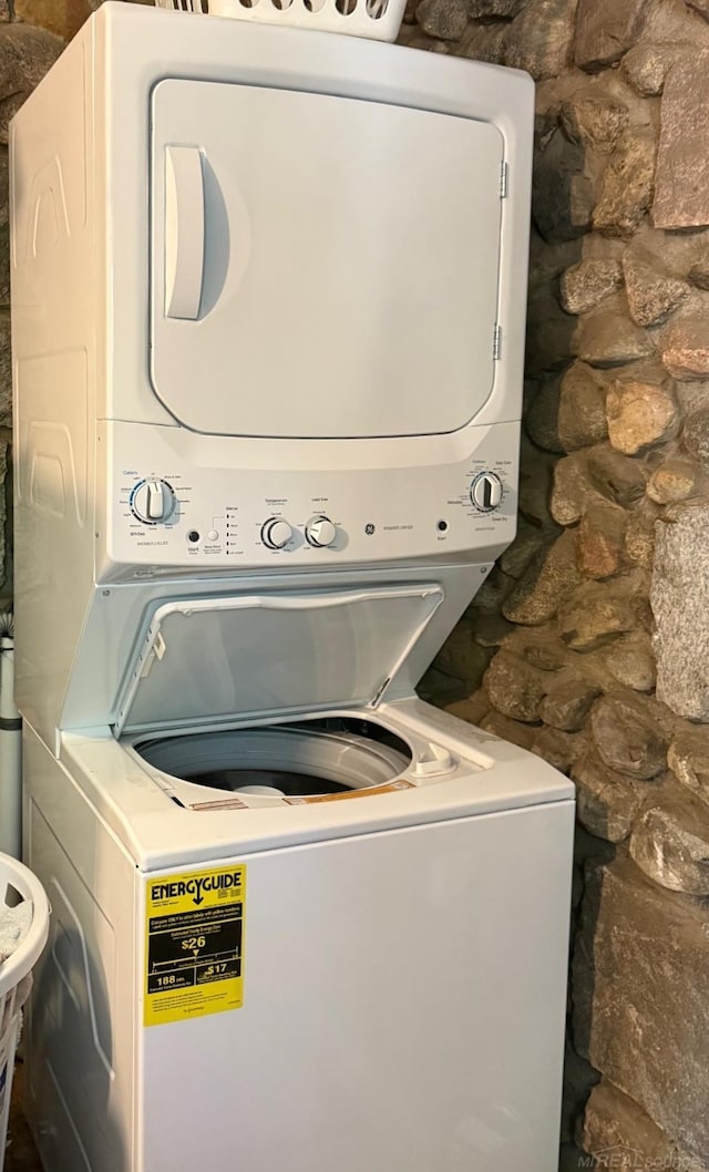 washroom featuring stacked washer and dryer