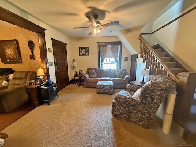 carpeted living room with ceiling fan