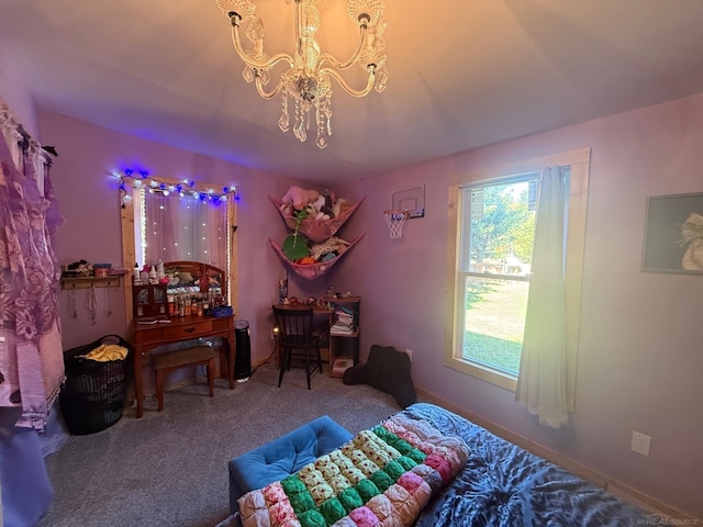 carpeted bedroom featuring a notable chandelier