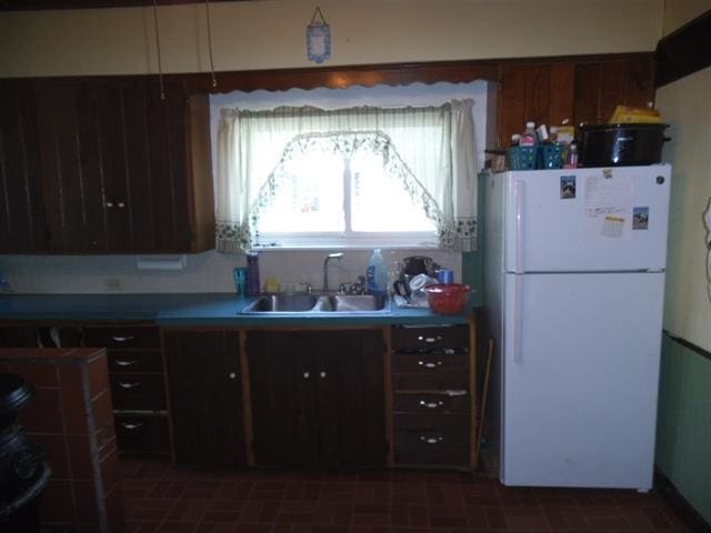 kitchen with white refrigerator and sink