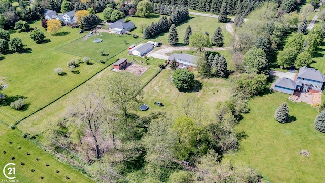 birds eye view of property with a rural view