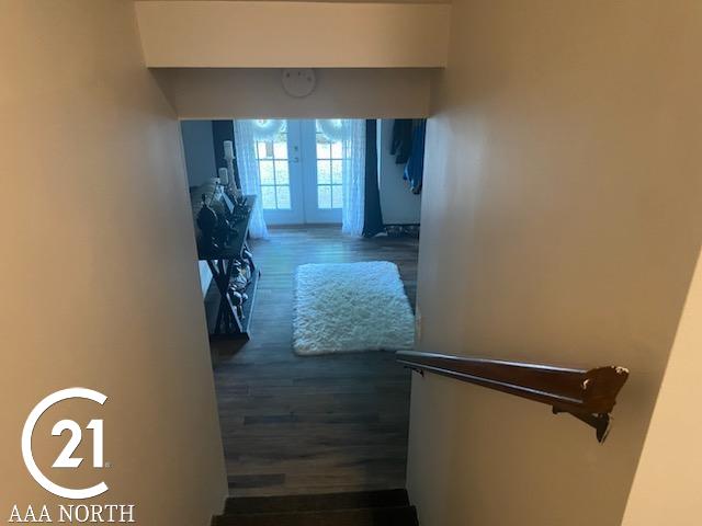 hall featuring french doors and dark hardwood / wood-style flooring