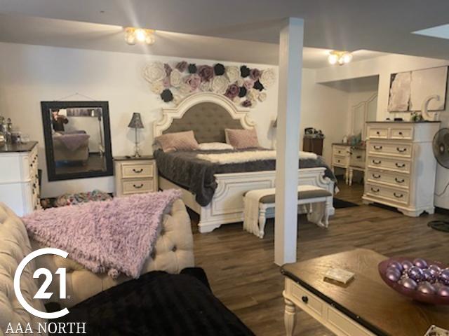 bedroom featuring dark hardwood / wood-style floors