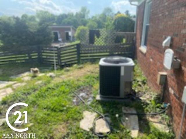 view of yard with central air condition unit