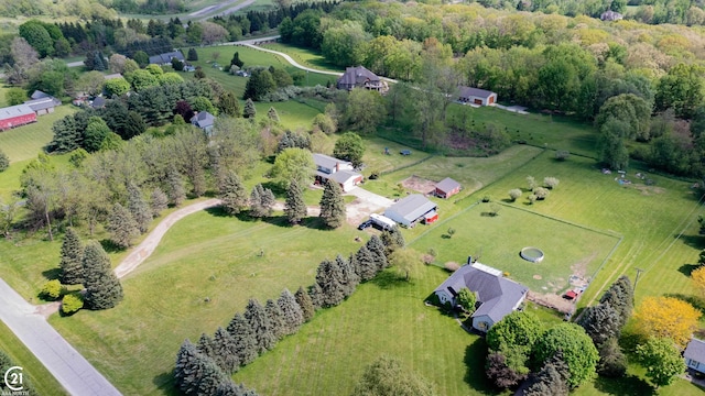 birds eye view of property with a rural view