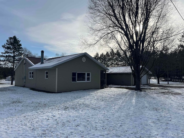 view of snow covered house