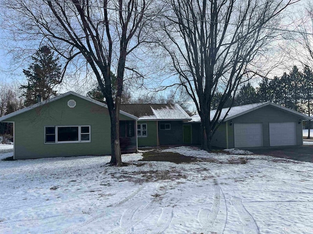 single story home featuring a garage