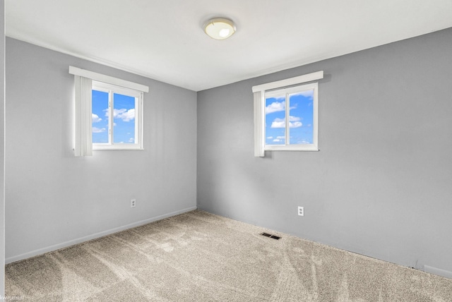 unfurnished room with carpet flooring