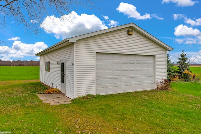 garage with a yard