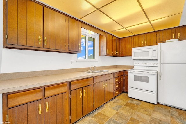 kitchen featuring sink and white appliances