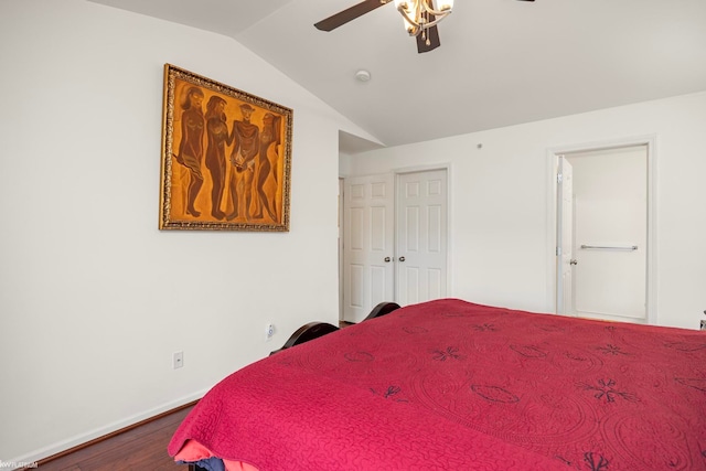 bedroom with ceiling fan, wood-type flooring, and vaulted ceiling