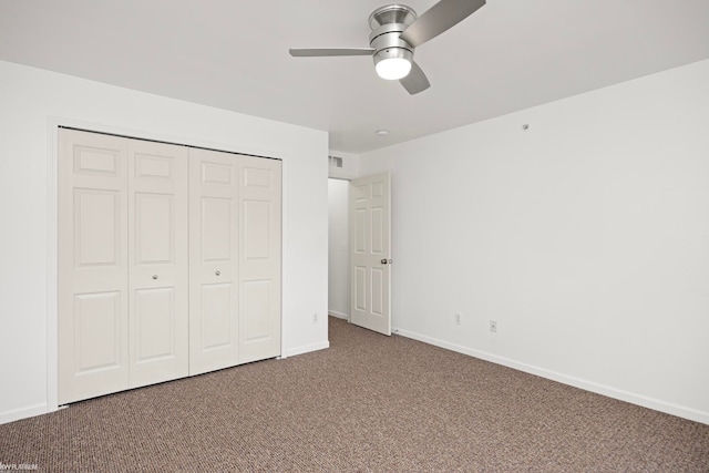 unfurnished bedroom featuring ceiling fan, carpet floors, and a closet