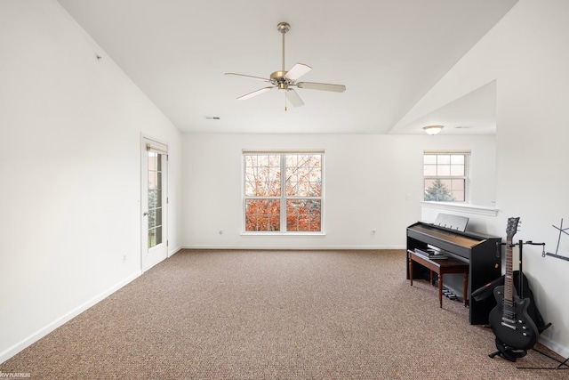 interior space featuring ceiling fan and lofted ceiling