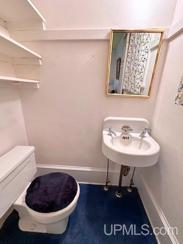 bathroom featuring toilet