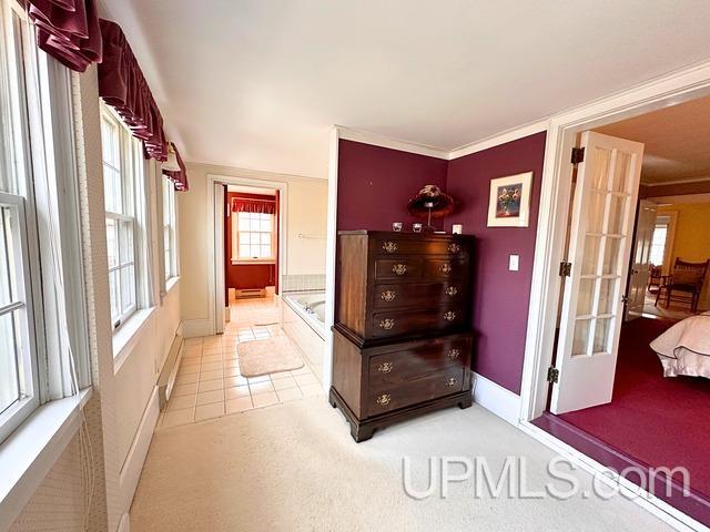 miscellaneous room with light tile patterned floors