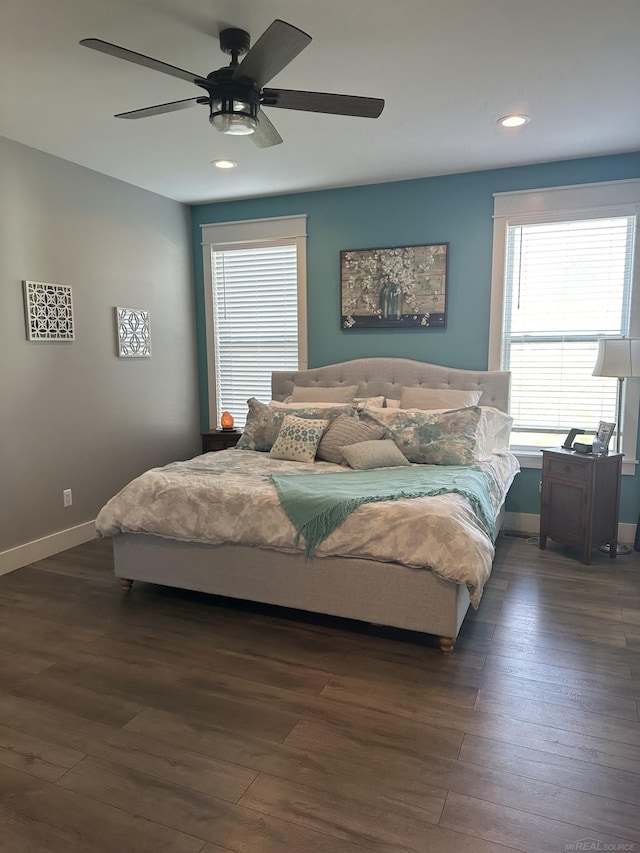 bedroom featuring dark hardwood / wood-style floors and ceiling fan