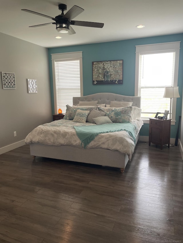 bedroom with dark wood-type flooring and ceiling fan