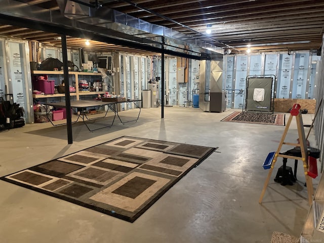 basement with water heater and heating unit