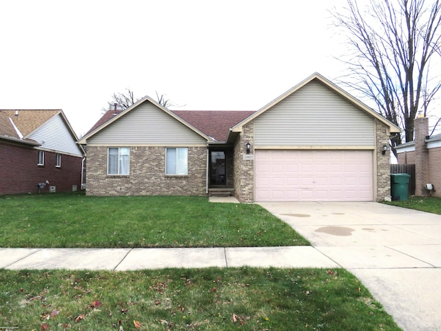 single story home featuring a garage and a front lawn