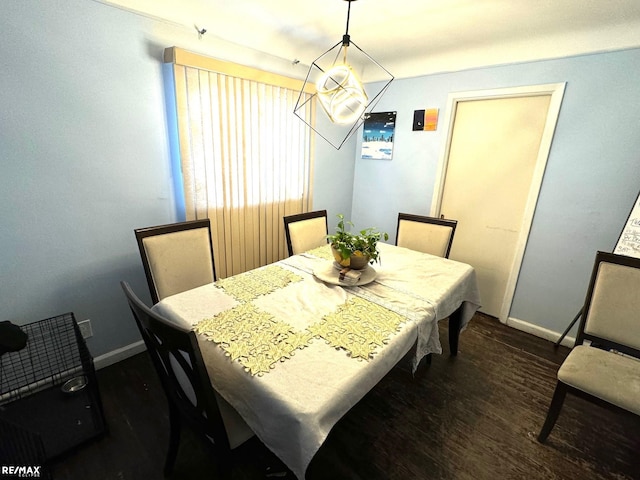 dining area with dark wood-type flooring