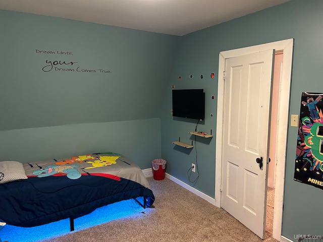 bedroom featuring carpet floors and baseboards