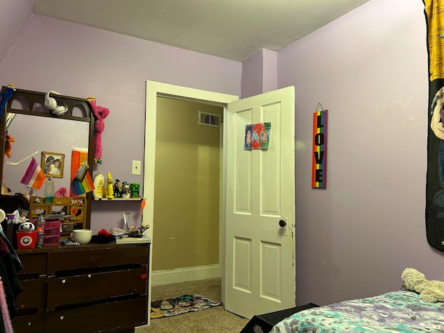 bedroom with visible vents and baseboards