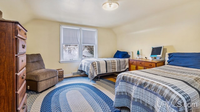 bedroom featuring vaulted ceiling