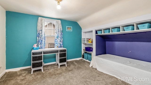 carpeted bedroom featuring lofted ceiling