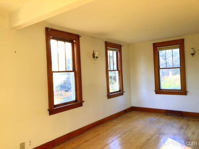 unfurnished room featuring light hardwood / wood-style flooring