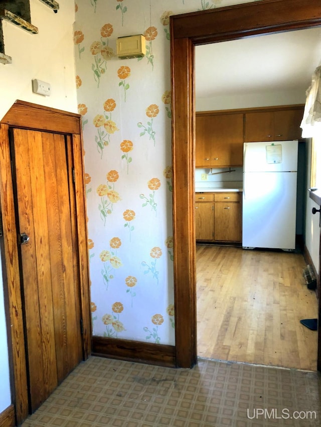 kitchen featuring white fridge and light hardwood / wood-style floors