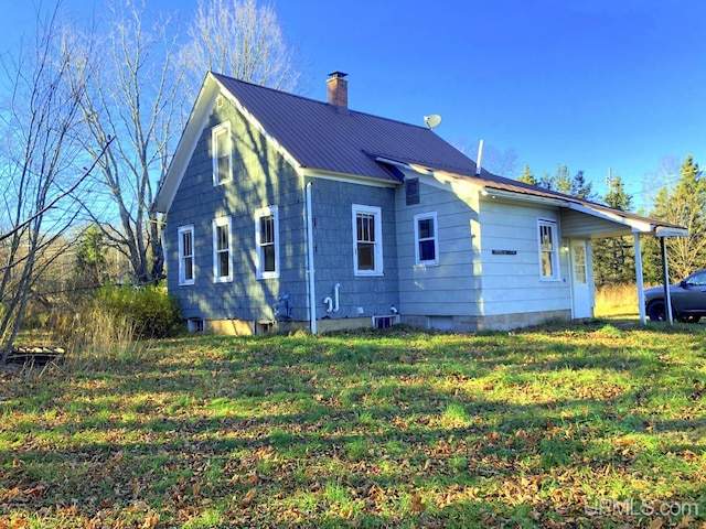 view of home's exterior featuring a yard