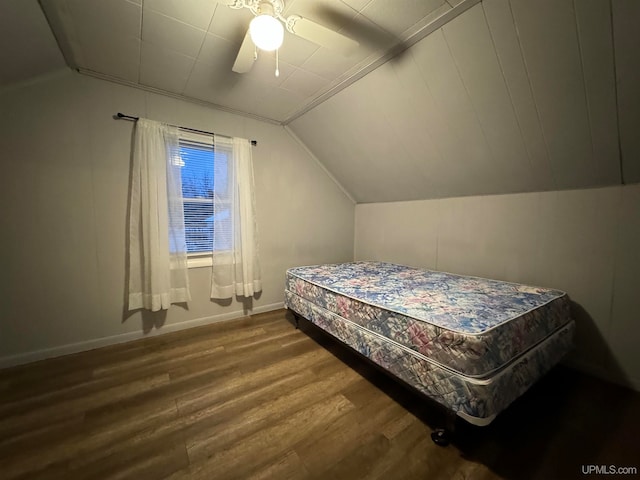 bedroom with wood-type flooring, ceiling fan, and lofted ceiling