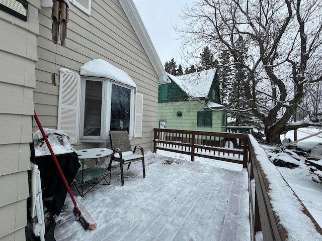 view of snow covered deck