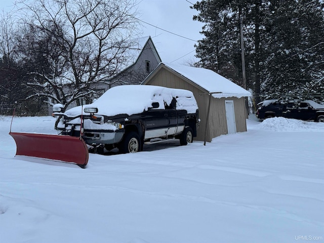 view of snow covered garage