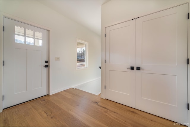 foyer entrance with light hardwood / wood-style flooring