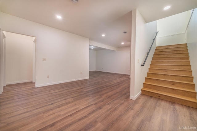 basement with hardwood / wood-style flooring