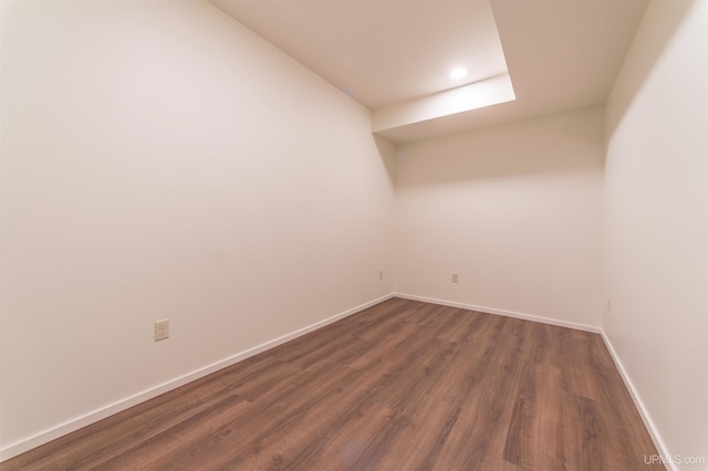 spare room with dark hardwood / wood-style flooring