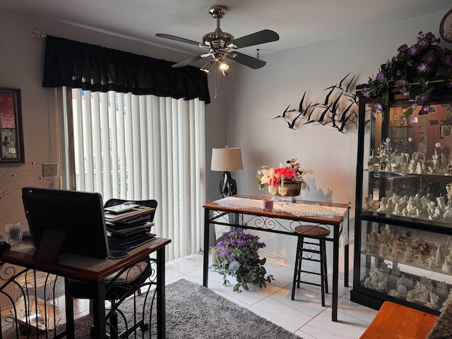 misc room featuring ceiling fan and light tile patterned floors