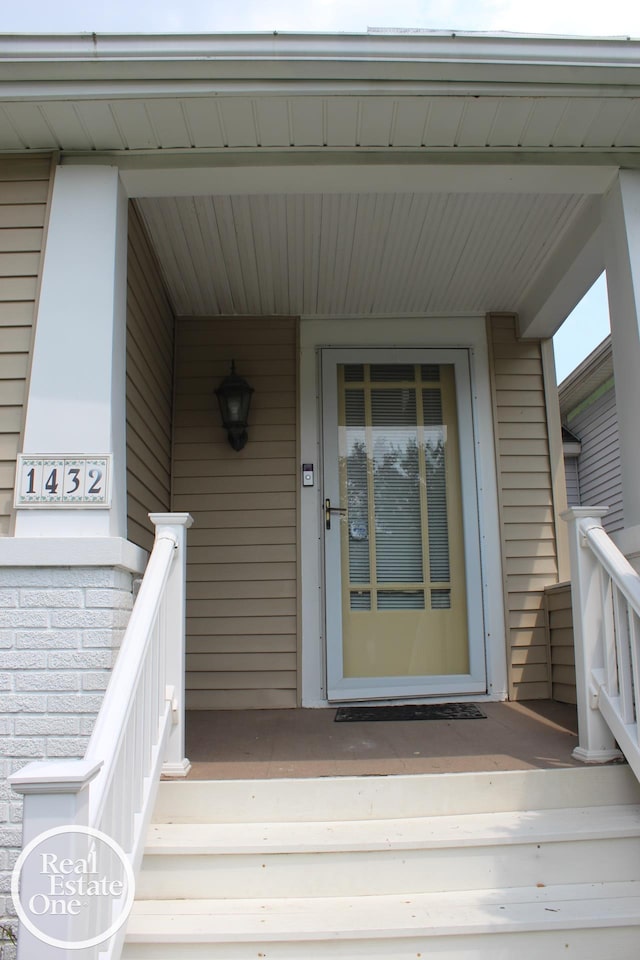 entrance to property with covered porch