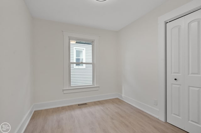 unfurnished room featuring light hardwood / wood-style floors