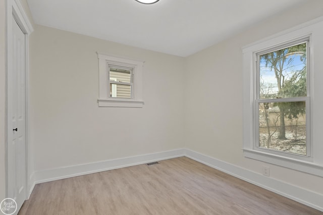 spare room featuring light hardwood / wood-style floors