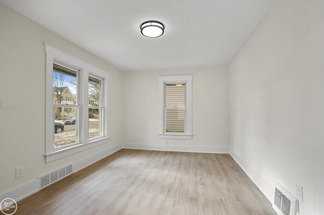 empty room featuring light hardwood / wood-style floors