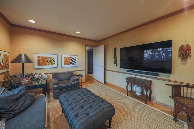 living room with ornamental molding and hardwood / wood-style flooring