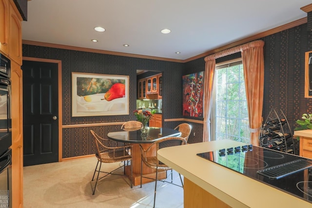 dining space featuring light colored carpet and ornamental molding